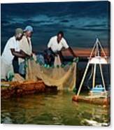 Night fishing, Lake Victoria, Kenya. Fishermen dragging nets at