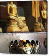 Oil Lamp Burning In Front Of Buddha Statues At Wat Suthep, Chiang Mai, Thailand Canvas Print