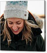 Portrait Of Woman With Snow In Her Hair Laughing At Sunset Canvas Print
