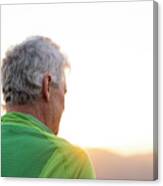 Rear View Of Senior Man On Top Of Hill Looking The Sunset Canvas Print
