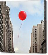 Red Balloon Floating Through City Canvas Print