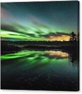 Reflection Of Aurora Borealis On Calm Lake At Night Canvas Print