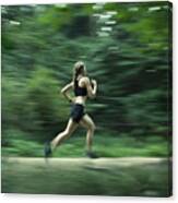 Runner During Training Run In Forest Canvas Print