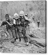Soldiers Helping Wounded Marine Canvas Print