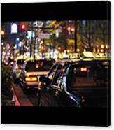 Taxis On Street At Night Canvas Print