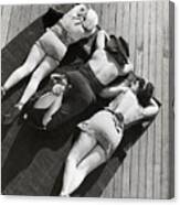 Three Sunbathers On Towel On Deck Canvas Print