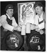 Two Men Give Cheers With Beer, Barrels Canvas Print