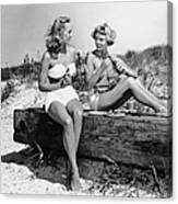 Two Women Drinking Soda On Beach Canvas Print