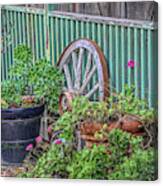 Wagon Wheels And Potted Plants Canvas Print