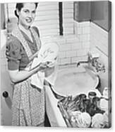 Woman Drying Dishes At Kitchen Sink Canvas Print