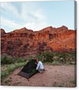 Woman Sets Up Her Tent Under The Orange Red Glow Of Fisher Towers Moab Canvas Print