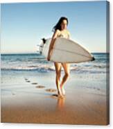 Woman Walking With Surfboard On Shore At Beach Canvas Print