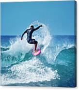 Young Male Surfer Surfing In The Water Canvas Print