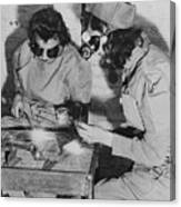 Young Women Working On Machinery Canvas Print