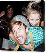 Young Friends Giving Piggybacks At Party #1 Canvas Print