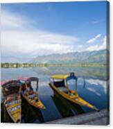 A Kashmiri Man Paddling A Shikara (traditional Boat) On Dal Lake Of Kashmir, India. Canvas Print