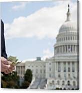 A Politician Counting Money In Front Of The Us Capitol Building Canvas Print