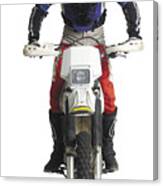 A Young Caucasian Male Dirtbiker Sits Upon His Motorcycle And Races Forward Canvas Print