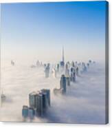 Aerial View Of Dubai Frame And Skyline Covered In Dense Fog During Winter Season Canvas Print