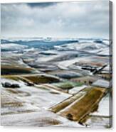 Aerial View Of Winter Landscape With Remote Settlements And Snow Covered Fields In Austria Canvas Print