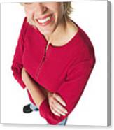 An Attractive Caucasian Blonde Woman In Jeans And A Red Shirt Smiles Up At The Camera Canvas Print