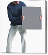 Attractive African American Man Wears Khaki Pants Grey Sweater Holds Blank Sign Smiles Enthusiasm Canvas Print