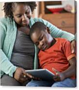 Black Mother And Son Using Digital Tablet Together Canvas Print