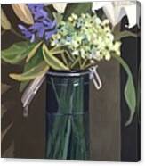Blue Glass Canister With Lillies Canvas Print