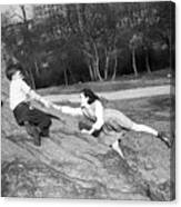 Boy And Girl (10-11) Playing In Park Canvas Print