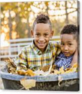 Brothers Hugging In Autumn Leaves In Wheelbarrow Canvas Print
