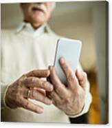 Close-up Of Mature Man Using Smart Phone. Canvas Print