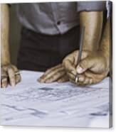 Close Up Of Two People Reviewing Building Blueprints Canvas Print