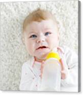 Cute Adorable Ewborn Baby Girl Holding Nursing Bottle And Drinking Formula Milk Canvas Print
