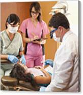 Dentist And Hygienists Examining Patient Canvas Print