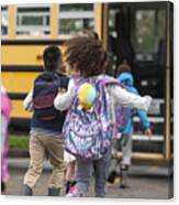 Diverse Group Of Happy Children Getting On School Bus Canvas Print