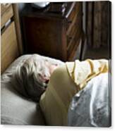 Elderly Caucasian Woman Sleeping On The Bed Canvas Print