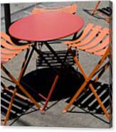 Empty Orange Cafe Table And Chairs With Shadows Canvas Print