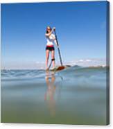 Family Stand Up Paddleboarding On The Isle Of Wight. Canvas Print