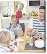 Family Using Technology At Breakfast Canvas Print