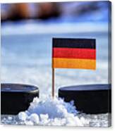 Germany Flag On Toothpick Between Two Hockey Pucks. Winter Classic. Flag On Frozen Pond On Unkempt Ice. Traditional Pucks For International Matches. Canvas Print