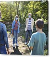 Grandparents And Grandchildren Meeting In Park During Covid-19 Pandemic Canvas Print