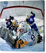 Ice Hockey, Goalie Reaching For Puck Rolling Into Goal (wide Angle) Canvas Print