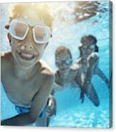 Kids Playing Underwater In Pool Canvas Print