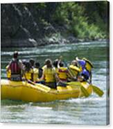Lifestyle Shot Of A Group Of People As They Float Down The River In A Raft Canvas Print