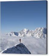 Lone Climber On Top Of A Snowy Peak Canvas Print