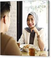 Malaysian Man And Woman Having Lunch In A Restaurant Canvas Print