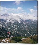 Man With A Backpack Looks At The Dachstein Massif Canvas Print