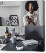 Mid Adult Woman Working In Her Home Office, Using Smartphone Canvas Print