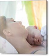 Mother And Baby Girl Sleeping On Bed Canvas Print