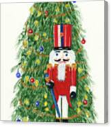 Nutcracker Standing In Front Of Christmas Tree Canvas Print